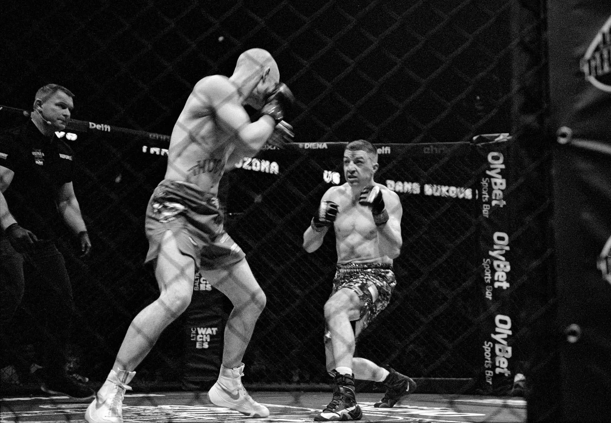 Ilford XP2 Super 400 35mm drum scan example showing black and white MMA cage fight action